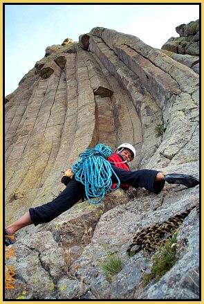 Rita Sanders warms up, preparing to climb Devils Tower in Wyoming