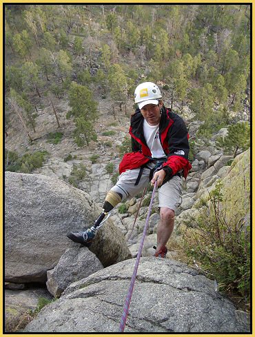 Lodge guest Todd Huston rappels down the side of  Devils Tower